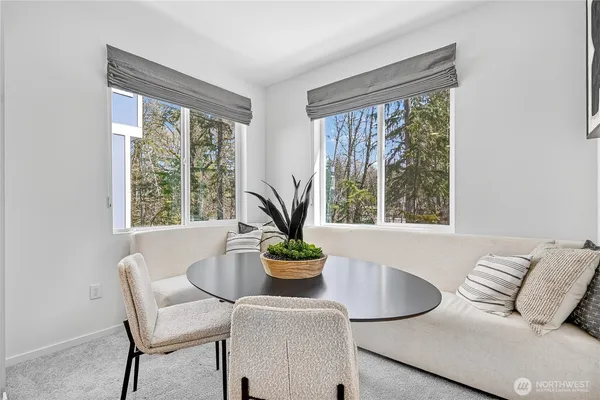 a dining room with furniture and window