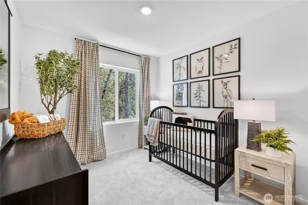 a bedroom with furniture and a window