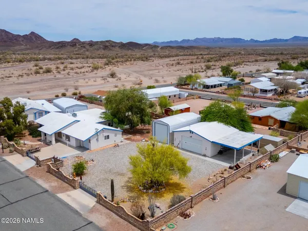 an aerial view of residential house with outdoor space and mountain view
