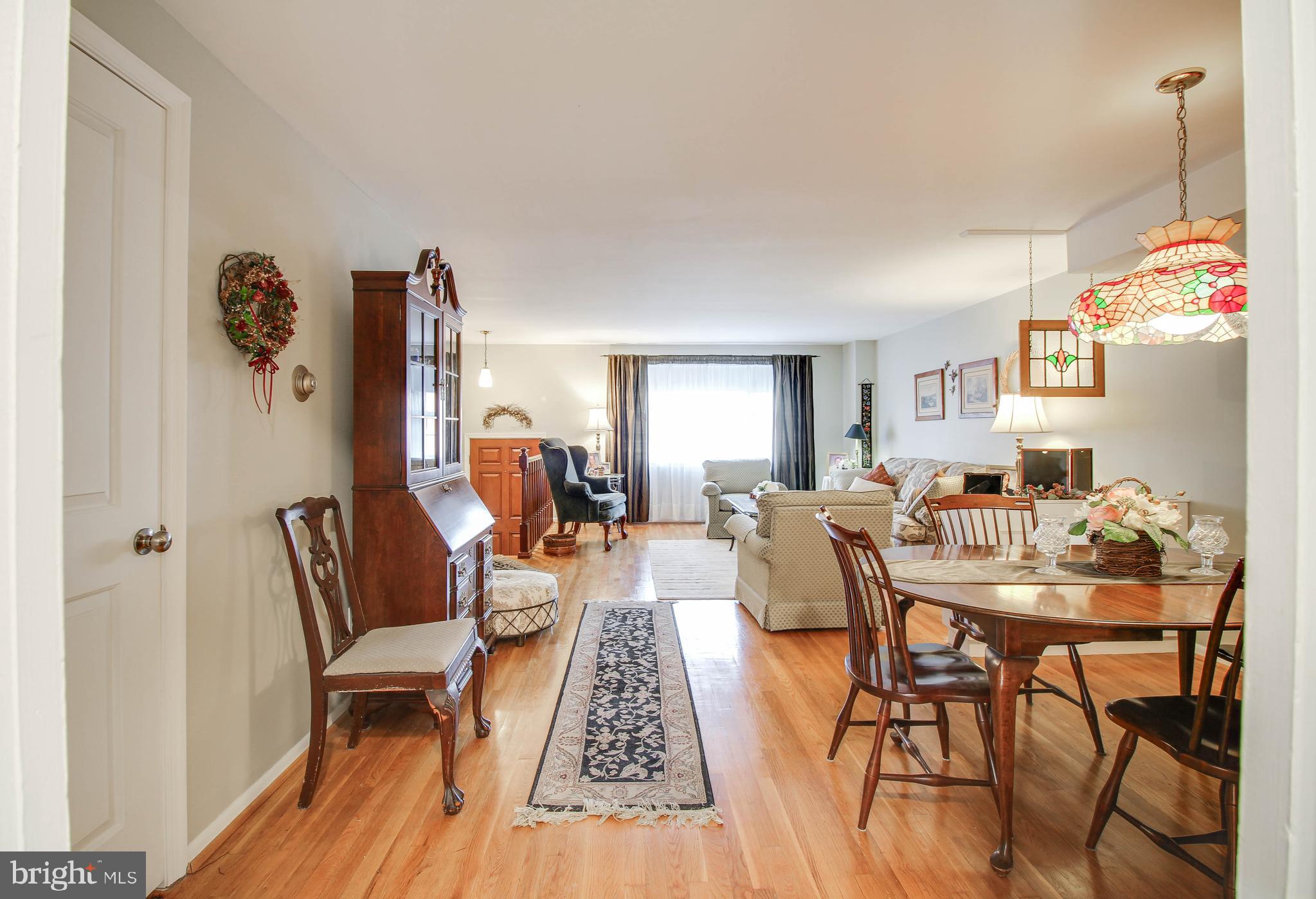 5649 Chelwynd Road Halethorpe, MD 21227 - Photo 6 of 44 a dining room with furniture and wooden floor