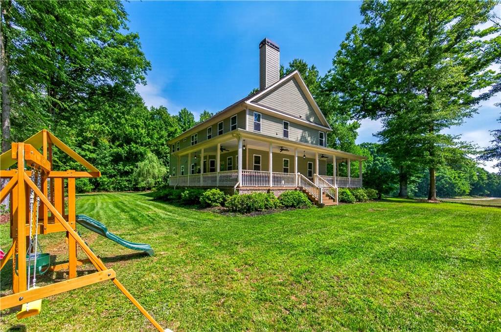 632 Geiger Road Jefferson, GA 30549 - Photo 48 of 55 a front view of a house with a yard