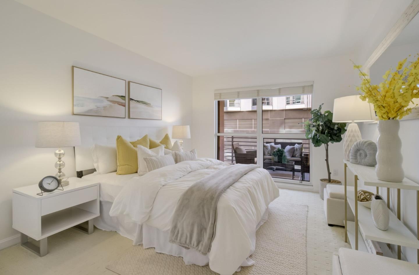 400 Beale Street, Unit 612 San Francisco, CA 94105 - Photo 17 of 38 a bedroom with a bed potted plant on dresser and a chandelier