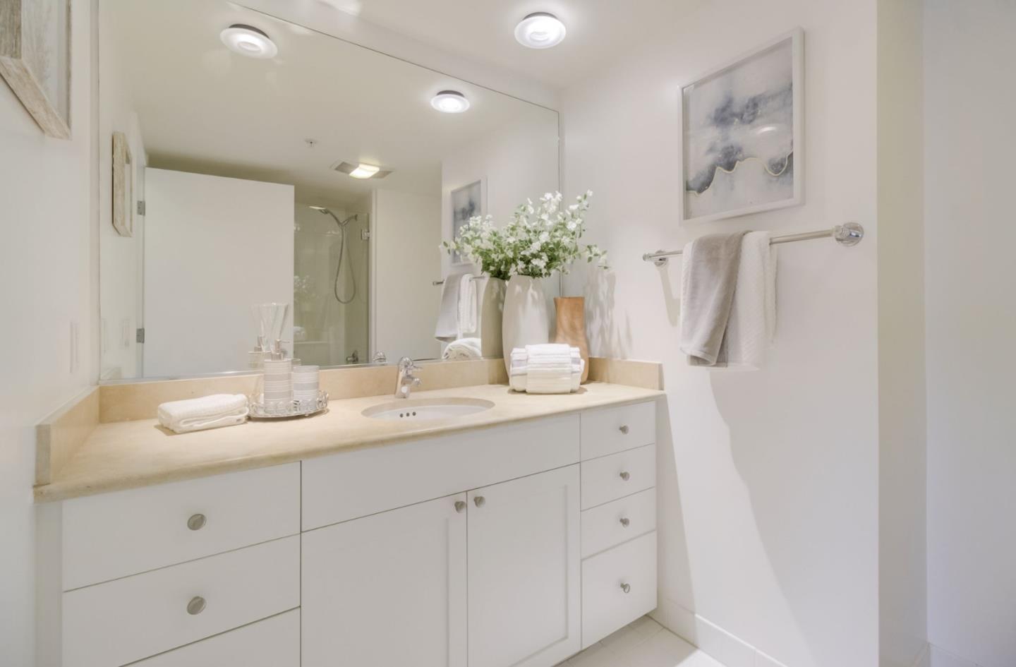 400 Beale Street, Unit 612 San Francisco, CA 94105 - Photo 19 of 38 a bathroom with a double vanity sink and mirror