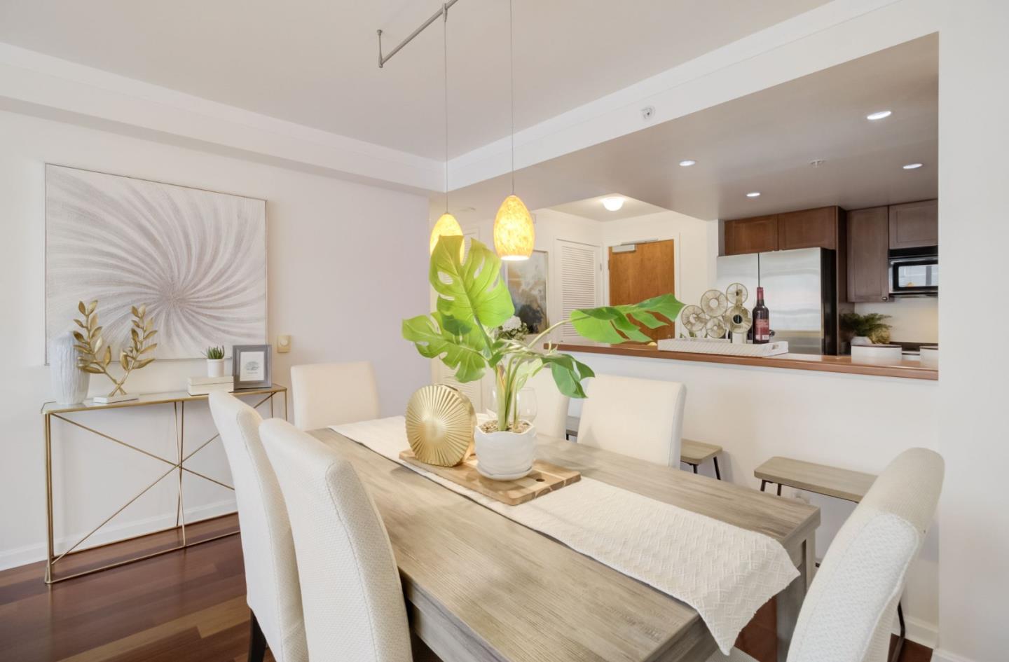 400 Beale Street, Unit 612 San Francisco, CA 94105 - Photo 5 of 38 a dining room with furniture and wooden floor