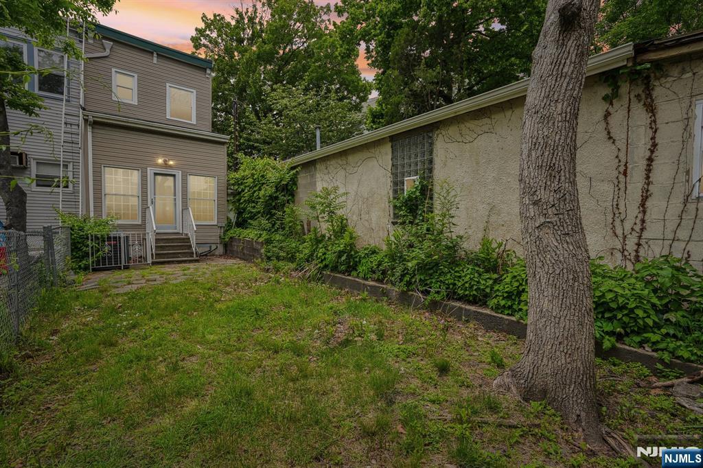 90 A Hackensack Plank Road Weehawken, NJ 07086 - Photo 30 of 40 a view of a backyard with plants and large tree