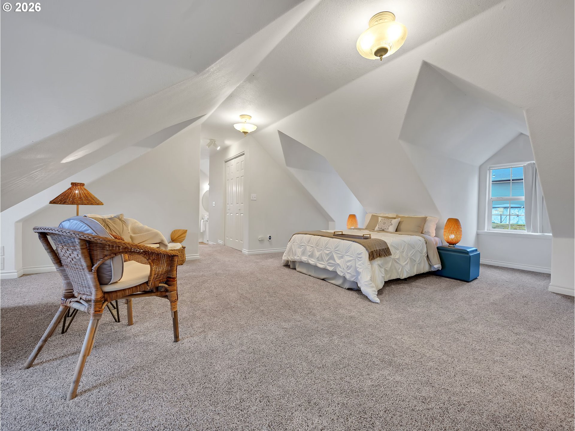 1312 Jackson Street Oregon City, OR 97045 - Photo 29 of 48 a bedroom with bed and a chandelier