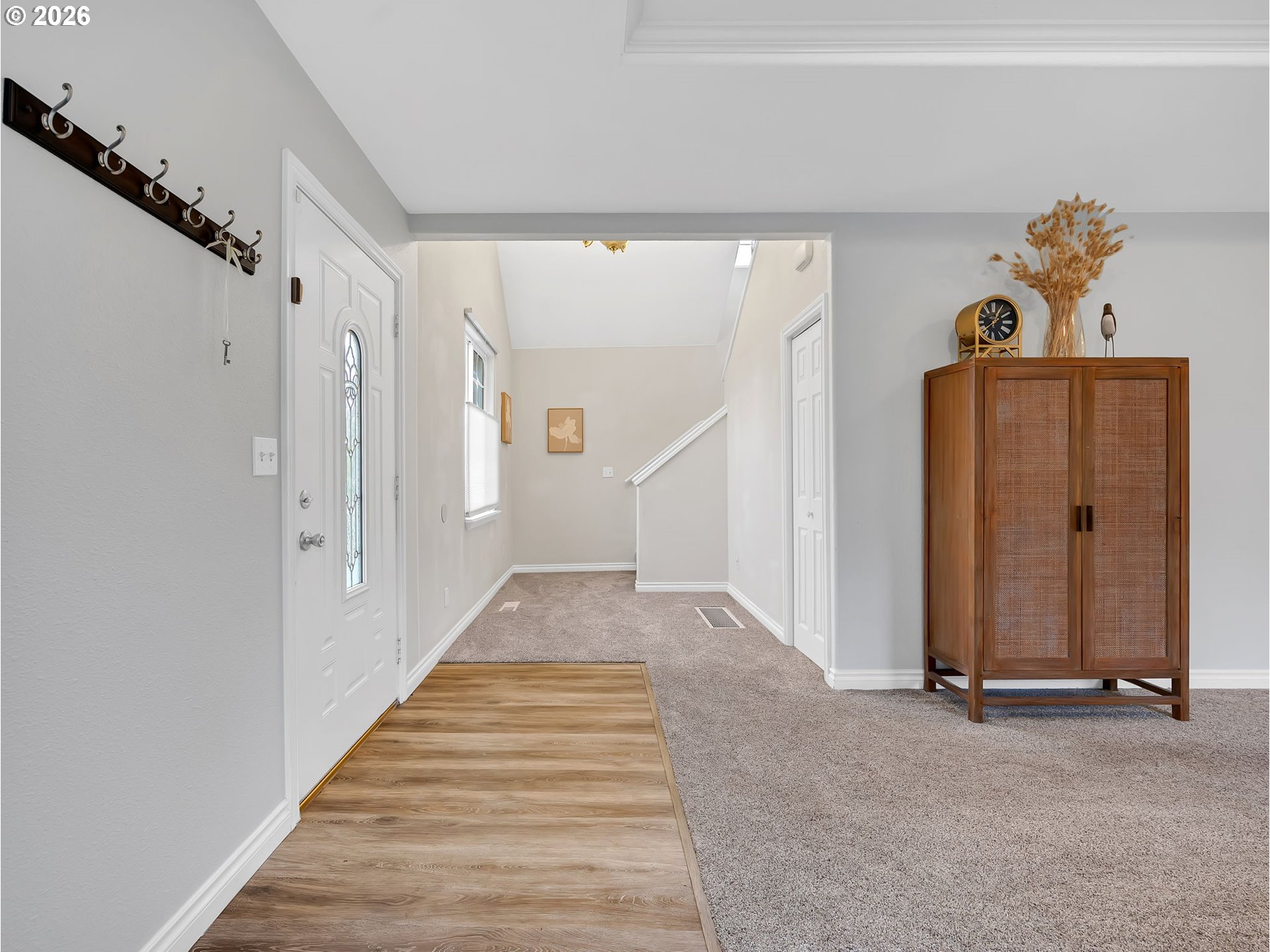 1312 Jackson Street Oregon City, OR 97045 - Photo 3 of 48 a view of a hallway with wooden floor and front door