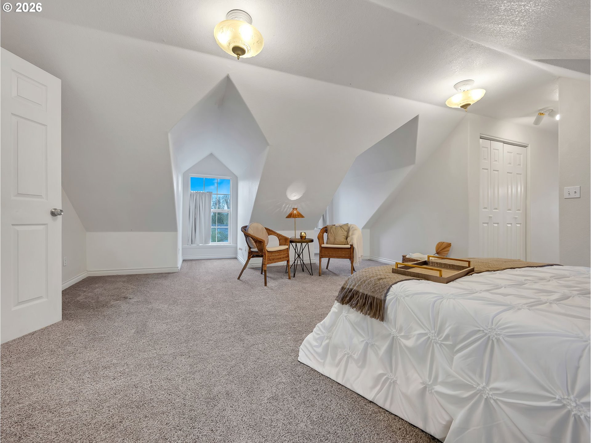 1312 Jackson Street Oregon City, OR 97045 - Photo 32 of 48 a bedroom with furniture and a chandelier