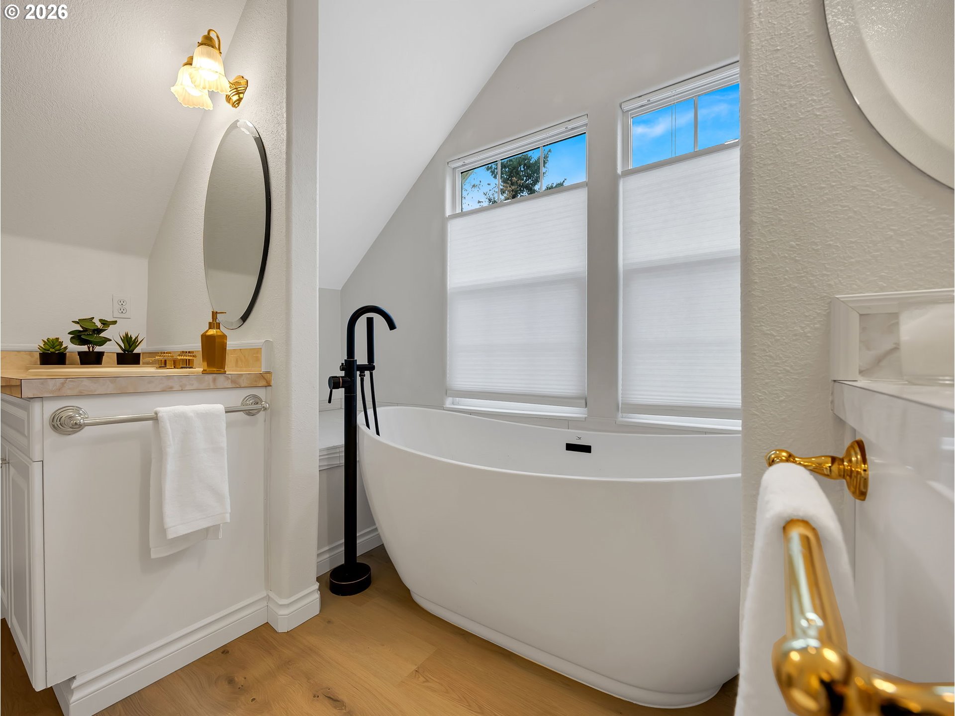 1312 Jackson Street Oregon City, OR 97045 - Photo 37 of 48 a bathroom with a tub sink and mirror