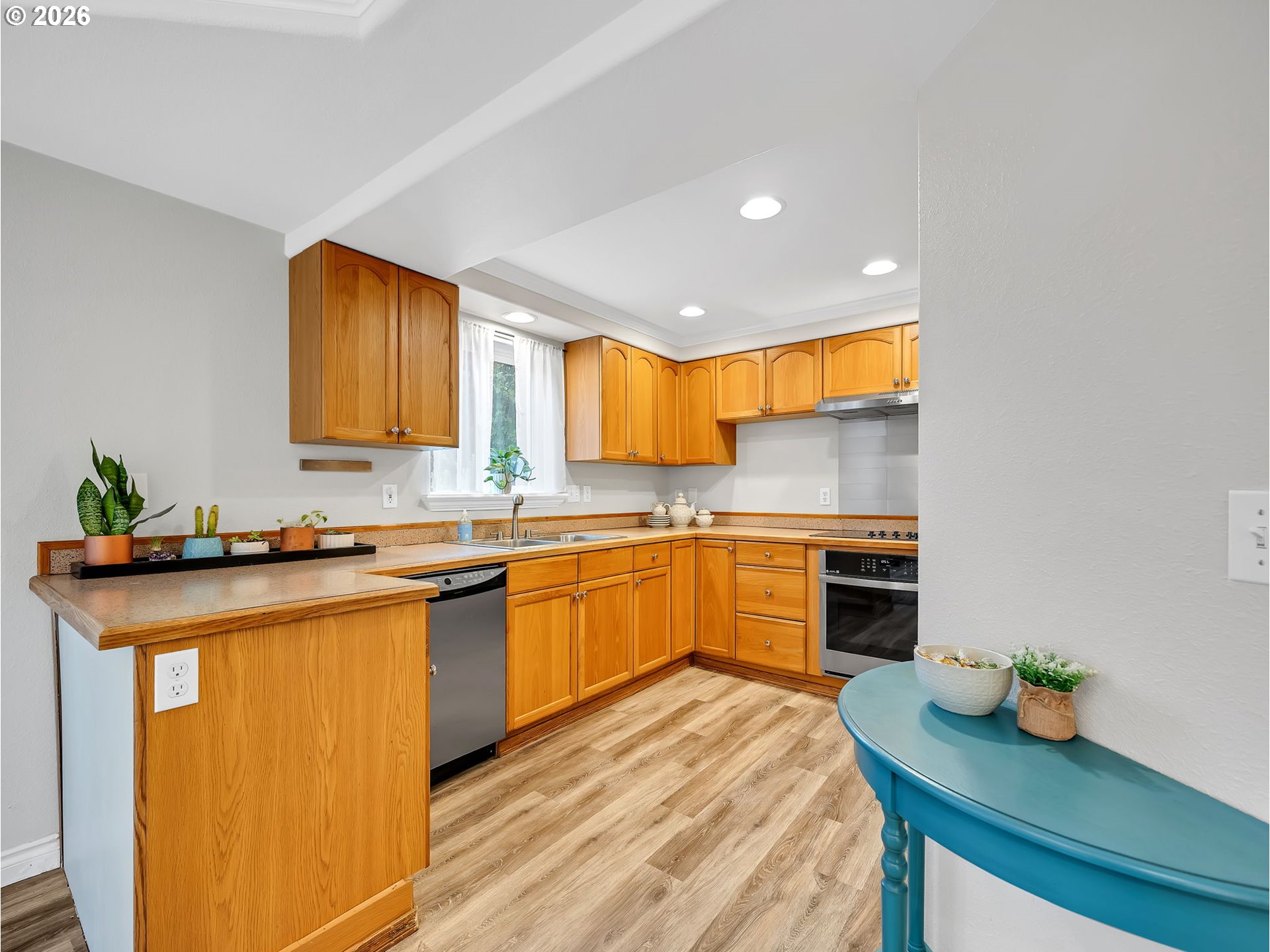 1312 Jackson Street Oregon City, OR 97045 - Photo 8 of 48 a kitchen with stainless steel appliances granite countertop a sink stove and refrigerator