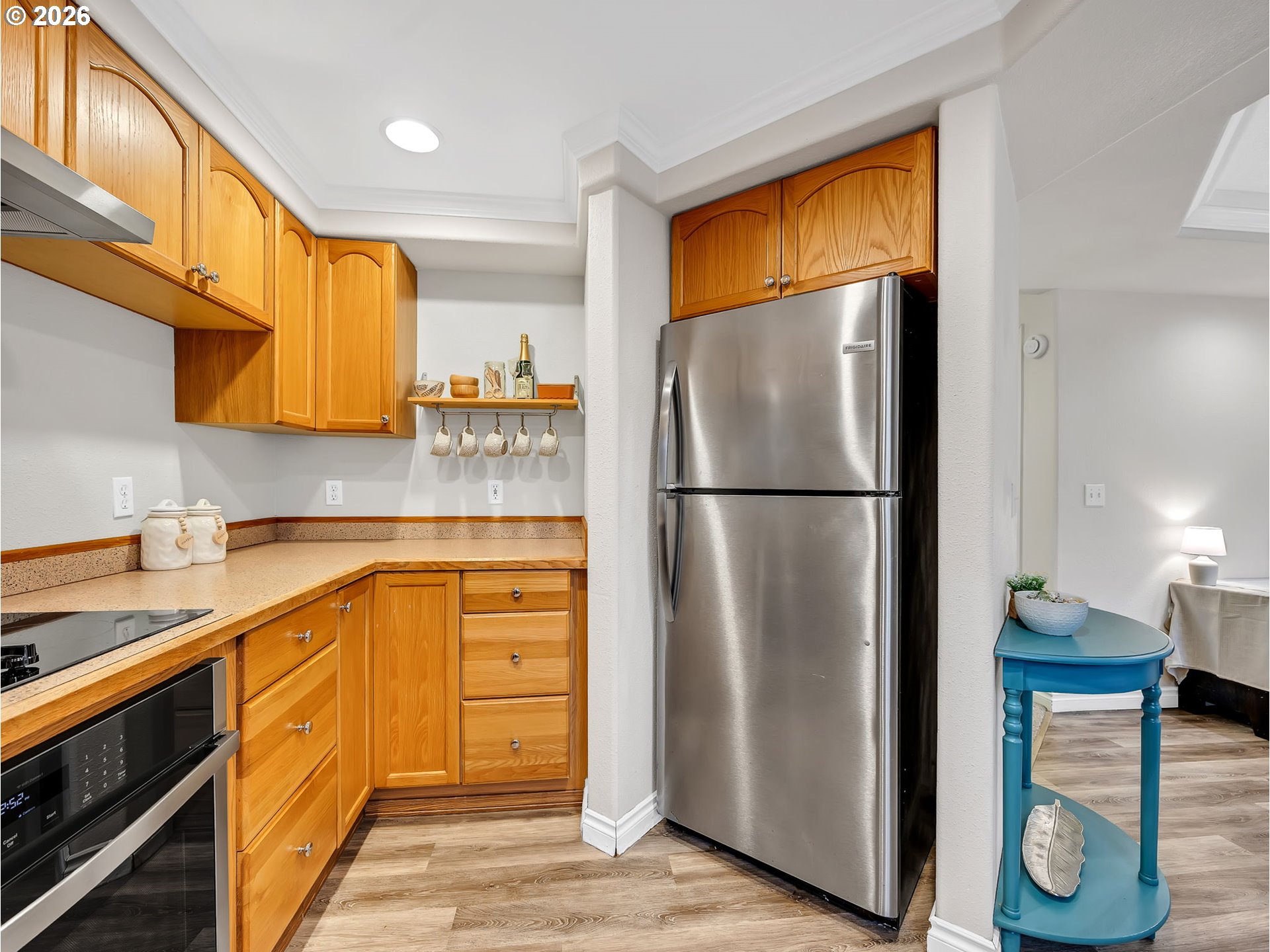 1312 Jackson Street Oregon City, OR 97045 - Photo 9 of 48 a kitchen with a refrigerator and cabinets