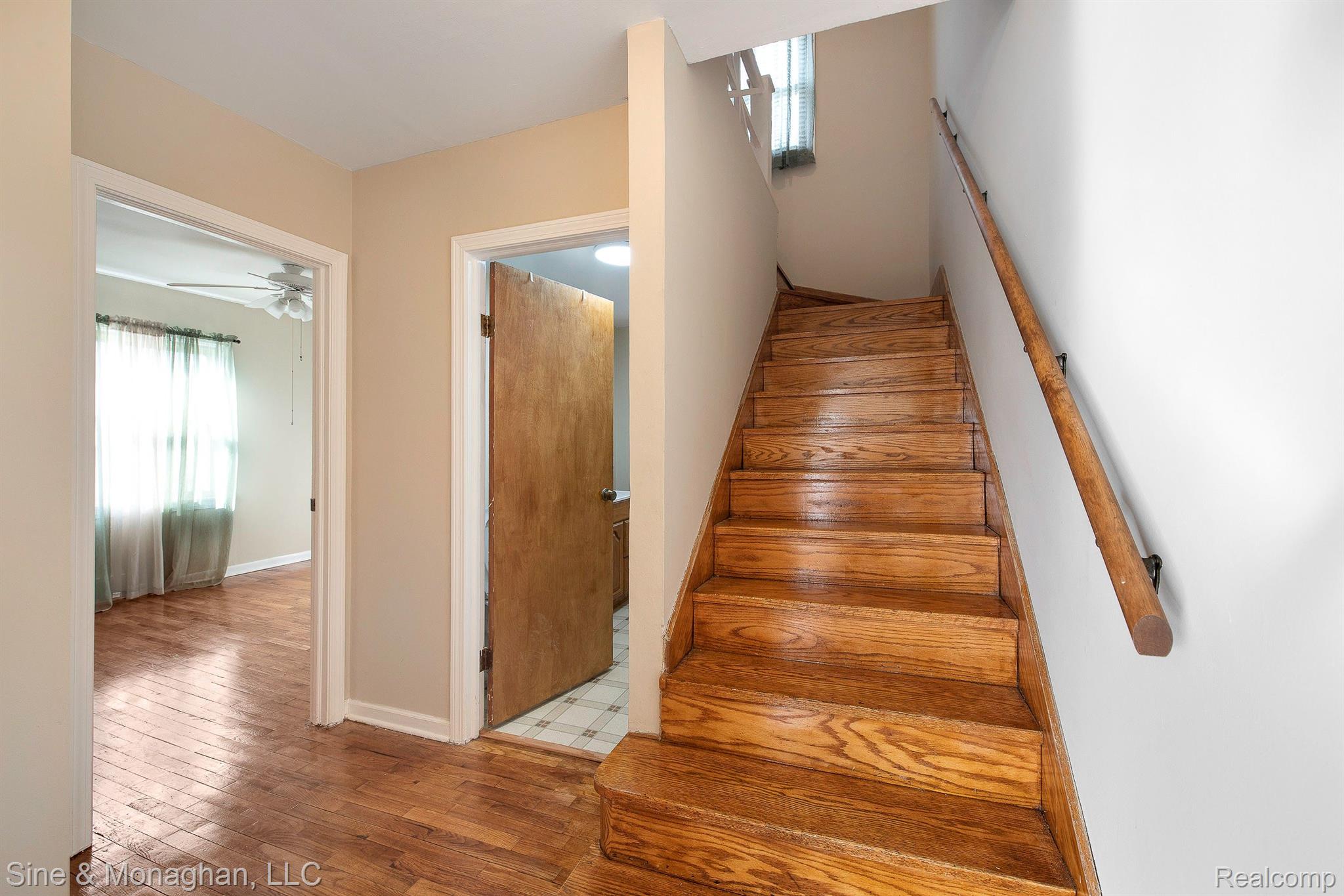 6135 North Genesee Road Flint, MI 48506 - Photo 14 of 45 Wood staircase to upper level