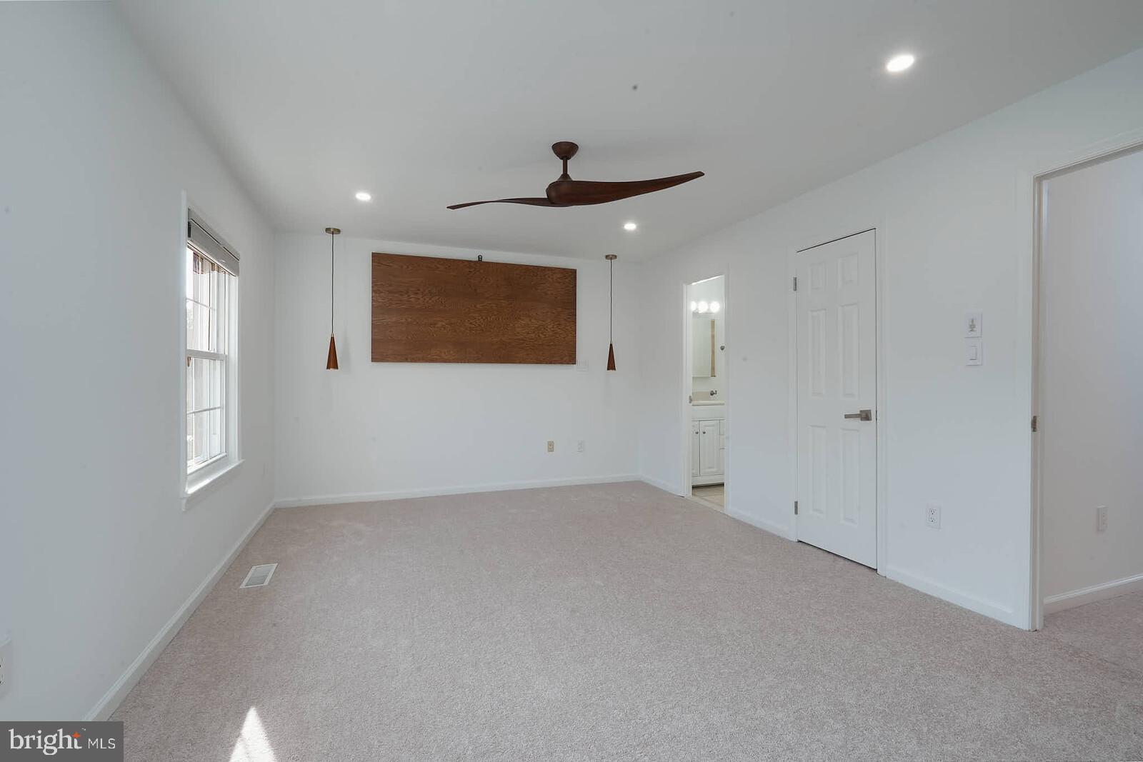 10246 Arizona Circle, Unit 36 Bethesda, MD 20817 - Photo 12 of 30 an empty room with windows and fan