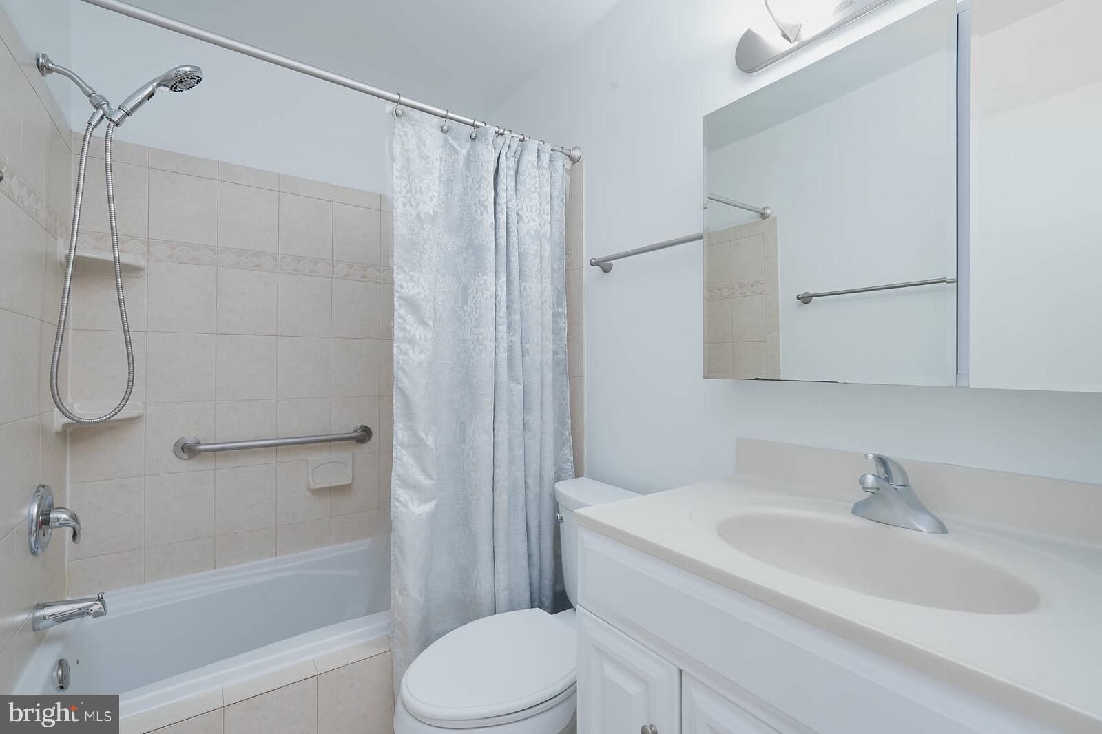 10246 Arizona Circle, Unit 36 Bethesda, MD 20817 - Photo 18 of 30 a bathroom with a sink toilet and shower