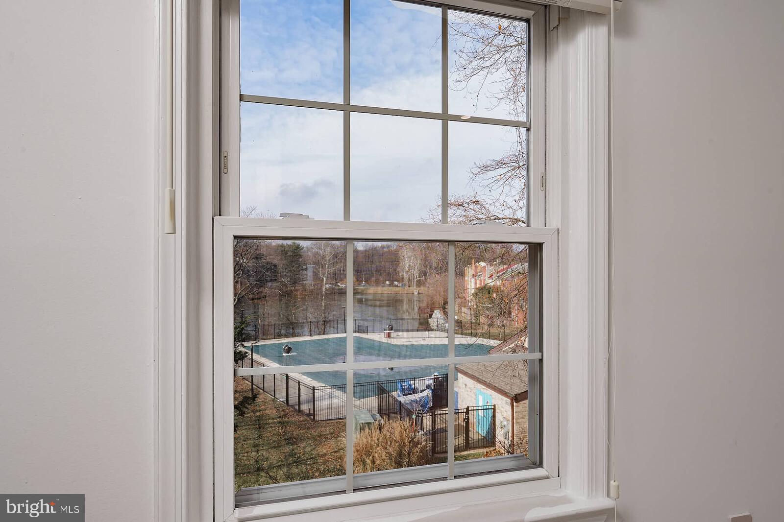10246 Arizona Circle, Unit 36 Bethesda, MD 20817 - Photo 20 of 30 an outdoor view of a glass door with wooden floor