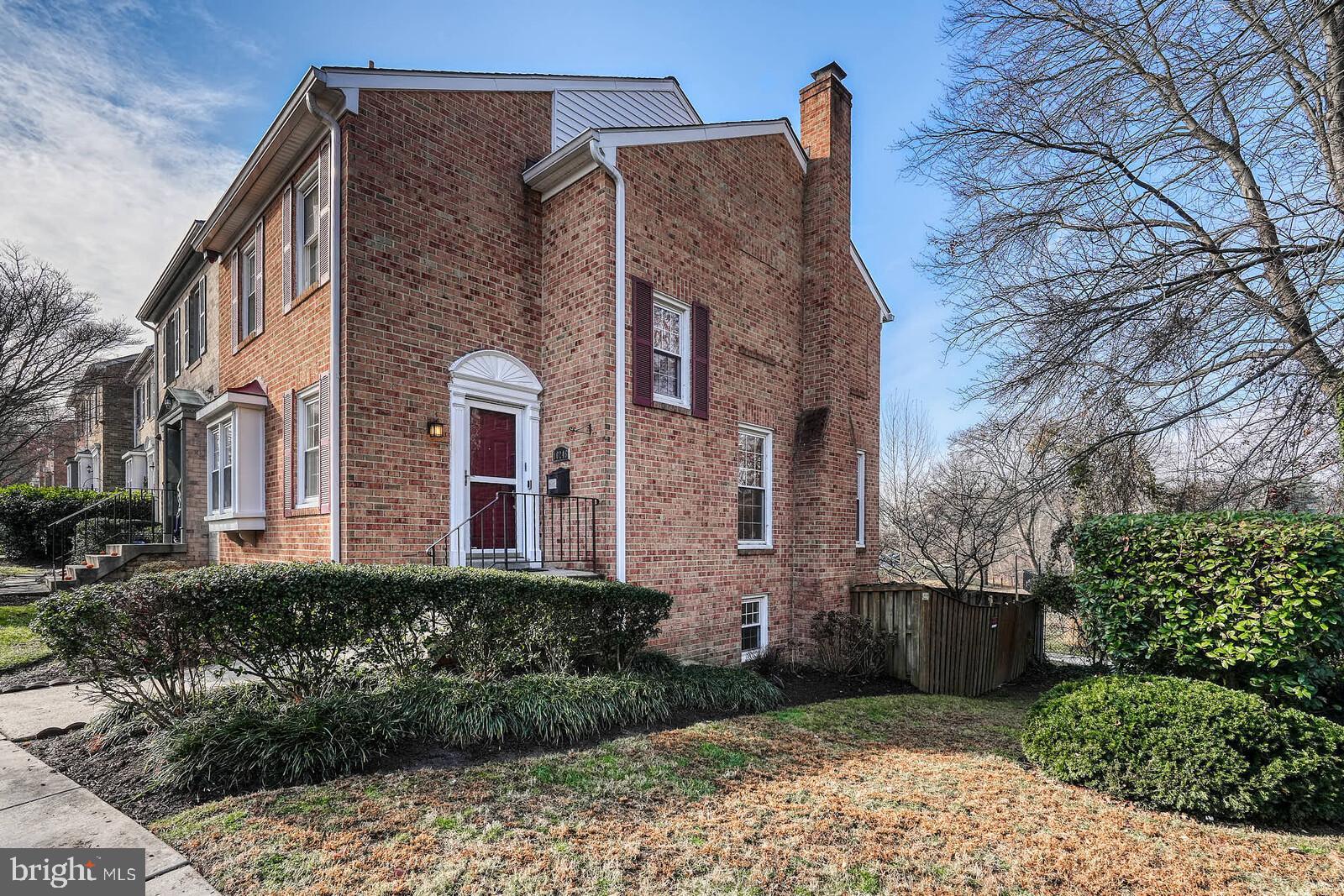 10246 Arizona Circle, Unit 36 Bethesda, MD 20817 - Photo 2 of 30 a front view of a house with garden