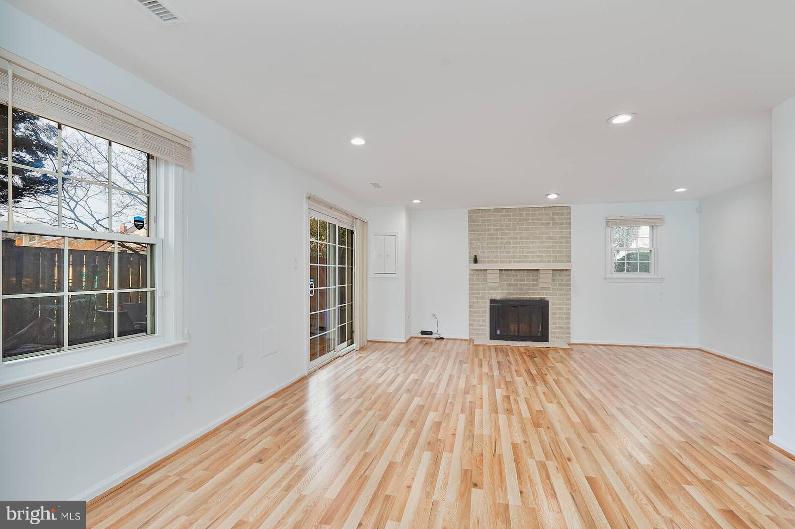 10246 Arizona Circle, Unit 36 Bethesda, MD 20817 - Photo 23 of 30 a view of empty room with wooden floor and fireplace