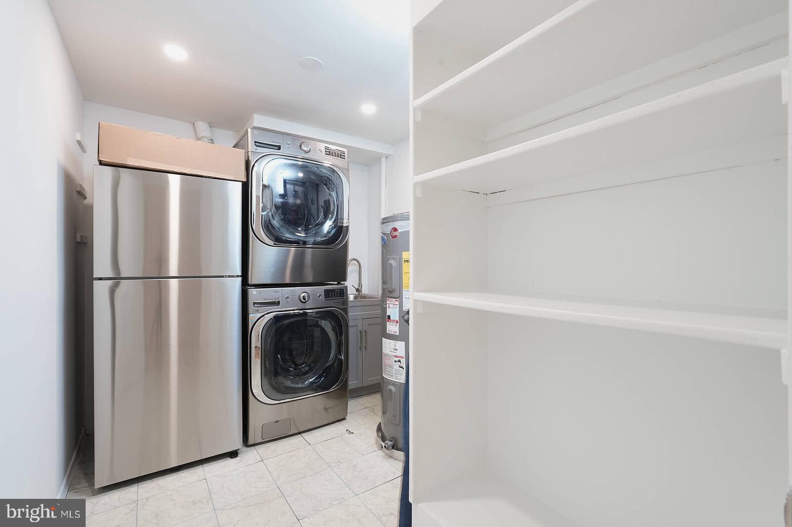 10246 Arizona Circle, Unit 36 Bethesda, MD 20817 - Photo 26 of 30 a utility room with dryer and washer