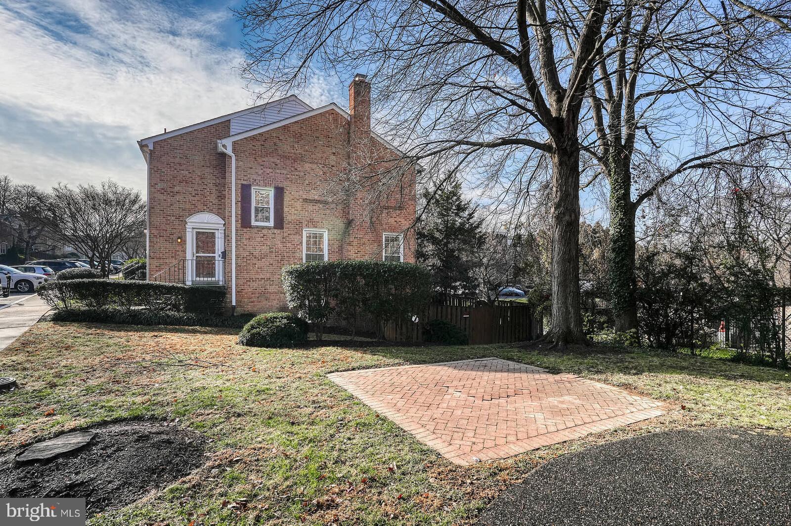 10246 Arizona Circle, Unit 36 Bethesda, MD 20817 - Photo 30 of 30 a front view of a house with a yard