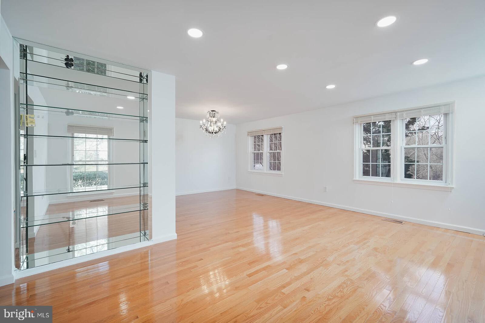 10246 Arizona Circle, Unit 36 Bethesda, MD 20817 - Photo 4 of 30 a view of an empty room with a window and wooden floor