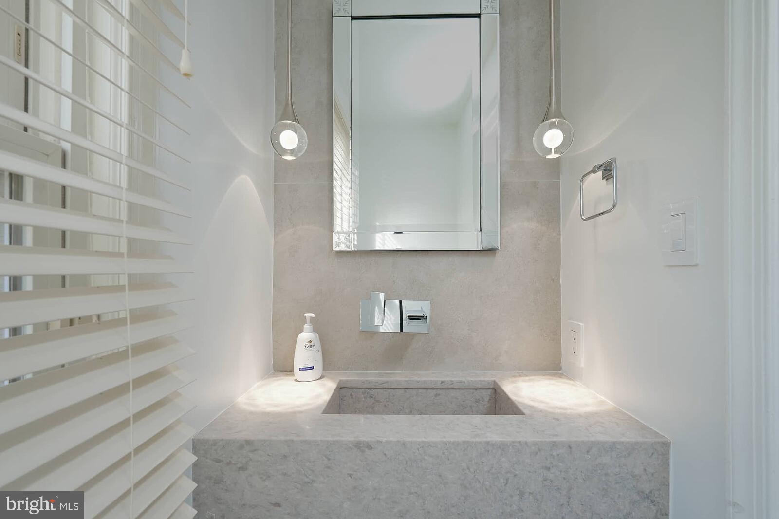 10246 Arizona Circle, Unit 36 Bethesda, MD 20817 - Photo 10 of 30 a bathroom with a sink and a mirror