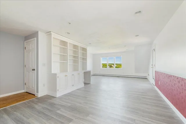 a bedroom with a large bed and a large window