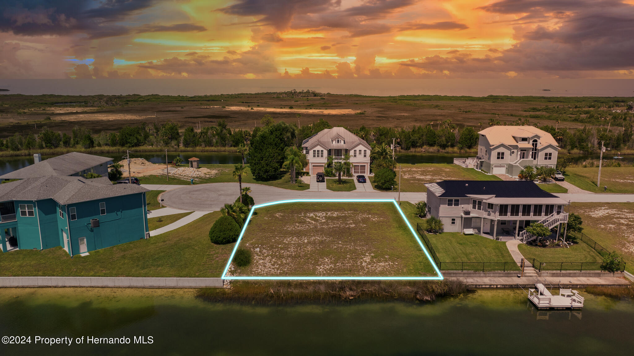 3358 Bluefish Drive Brooksville, FL 34607 - Photo 1 of 13 a view of a swimming pool with lounge chair