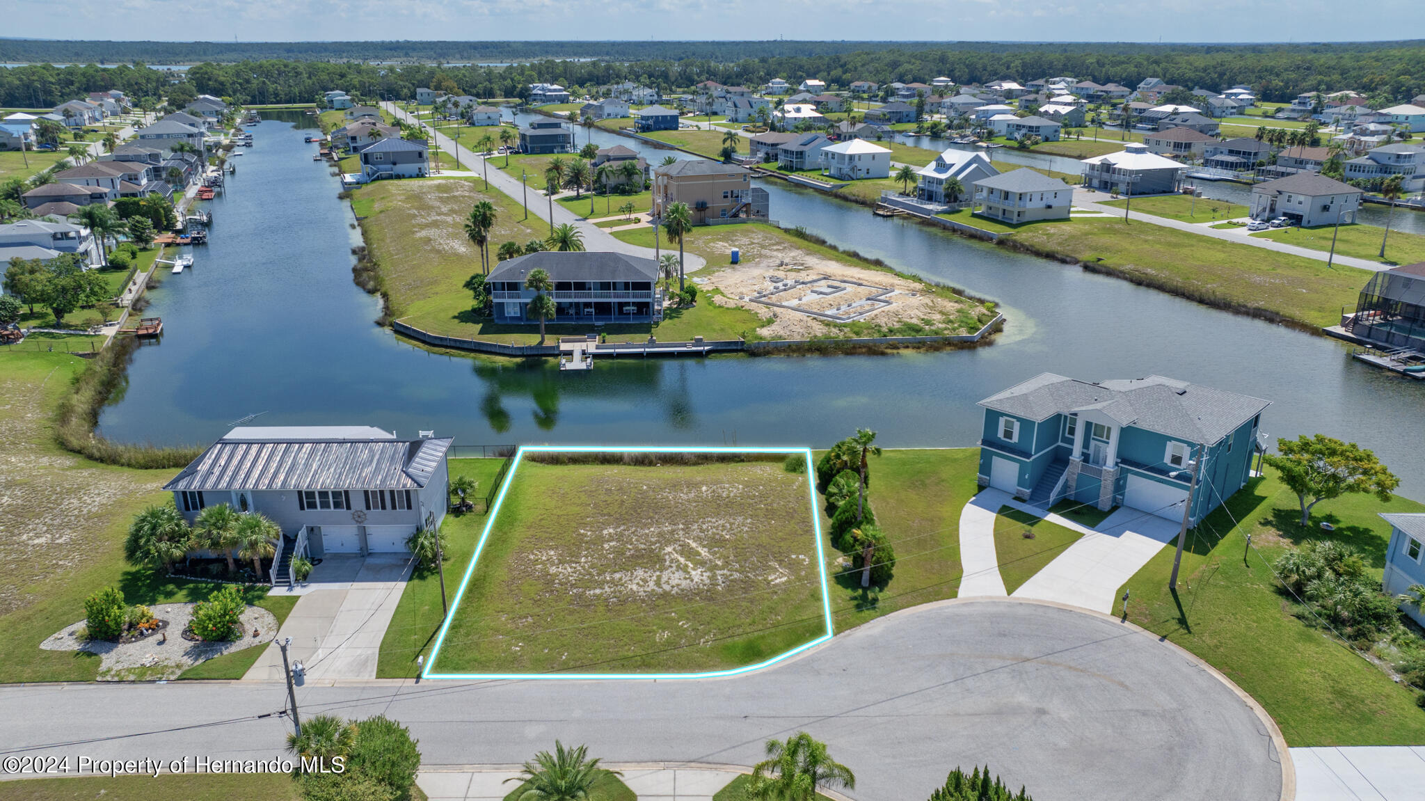 3358 Bluefish Drive Brooksville, FL 34607 - Photo 2 of 13 an aerial view of a house with a swimming pool yard and outdoor seating