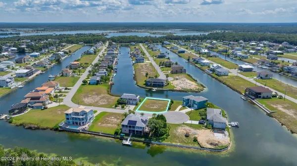 an aerial view of a residential houses with outdoor space