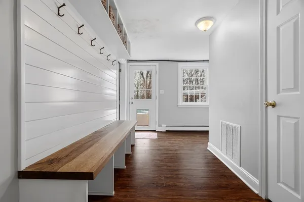 a bedroom with two beds and a window