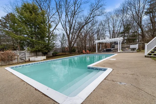 a view of a house with garden and sitting area
