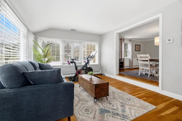 a living room with furniture and a rug