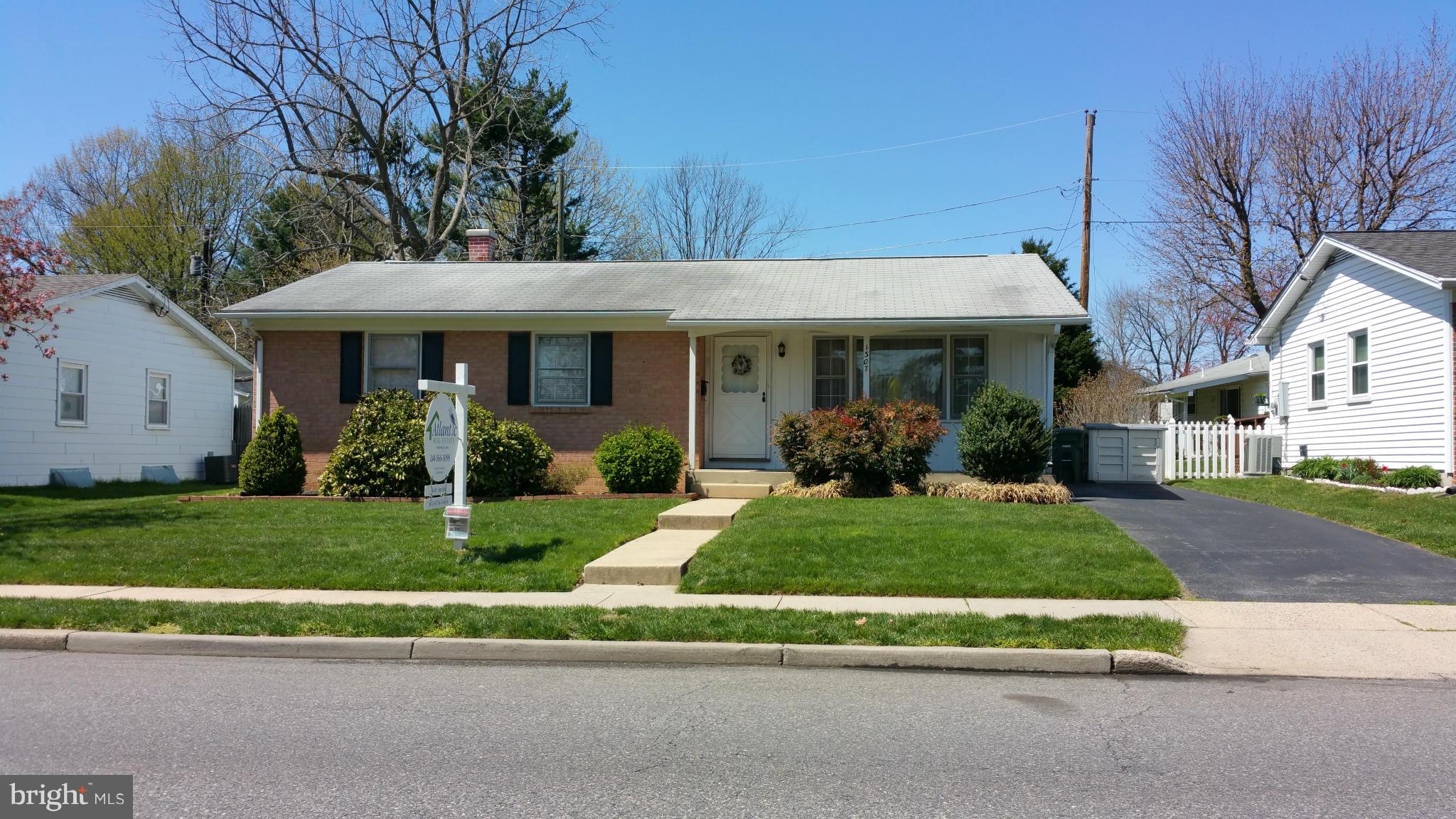 1307 Taney Avenue Frederick, MD 21702 - Photo 2 of 23 a front view of a house with a garden