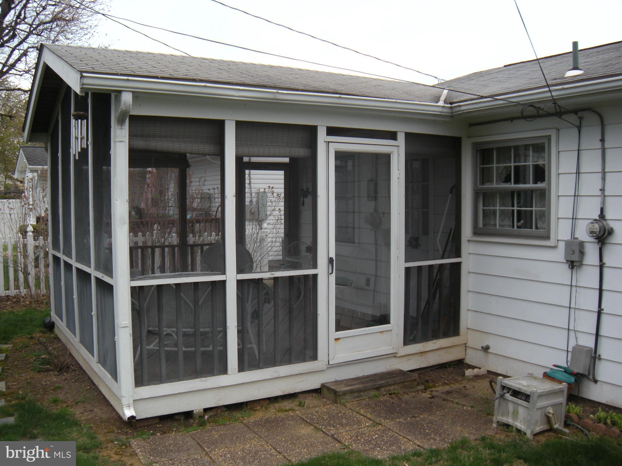 1307 Taney Avenue Frederick, MD 21702 - Photo 11 of 23 a view of a house with a large window and wooden fence