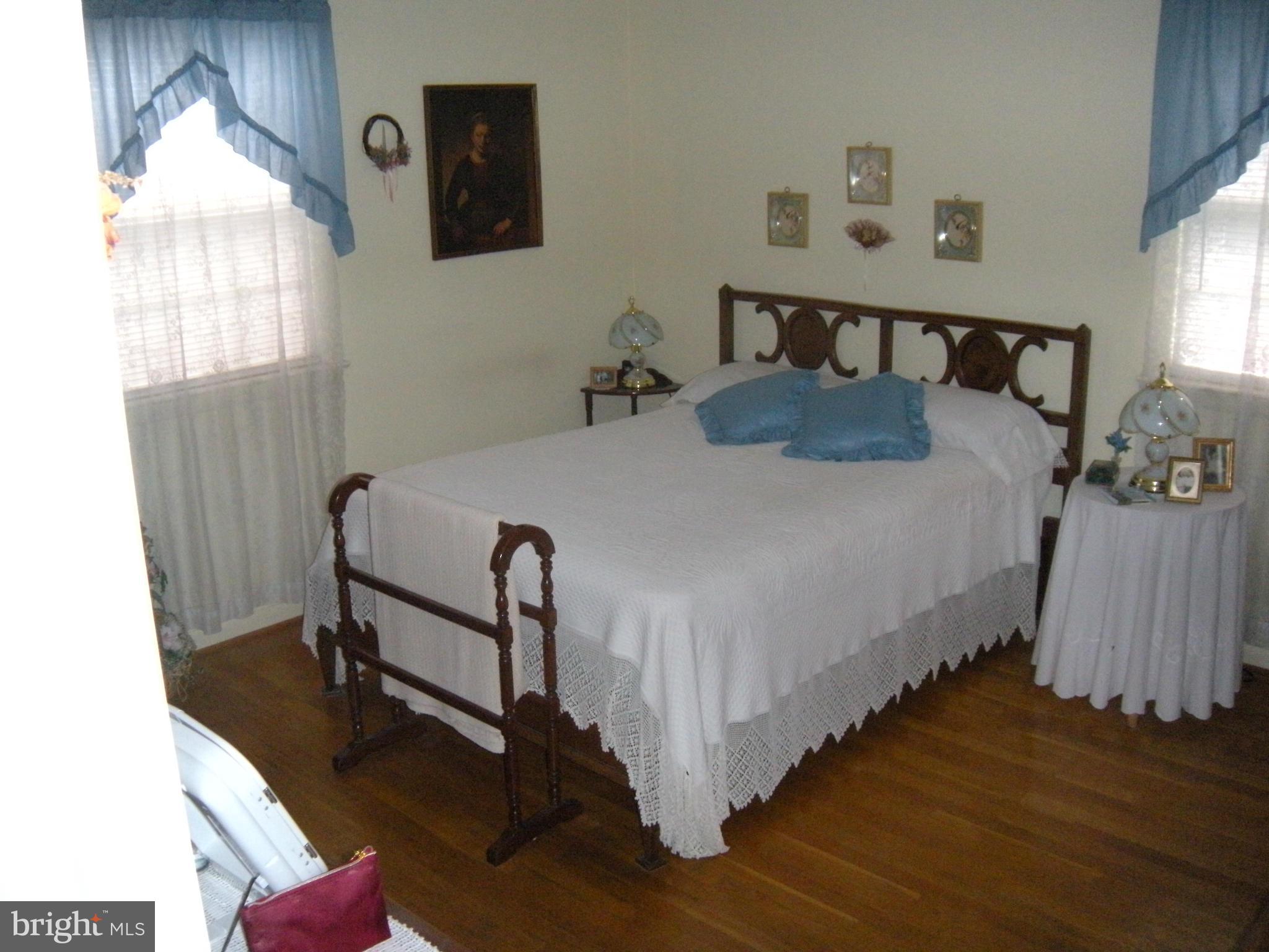 1307 Taney Avenue Frederick, MD 21702 - Photo 12 of 23 a bed sitting in a bedroom next to a window