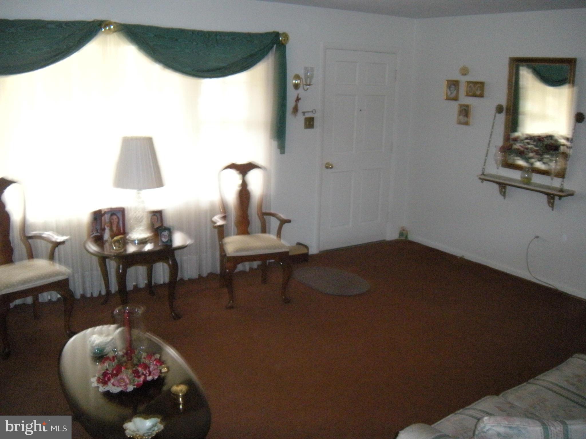 1307 Taney Avenue Frederick, MD 21702 - Photo 3 of 23 a living room with furniture and a window