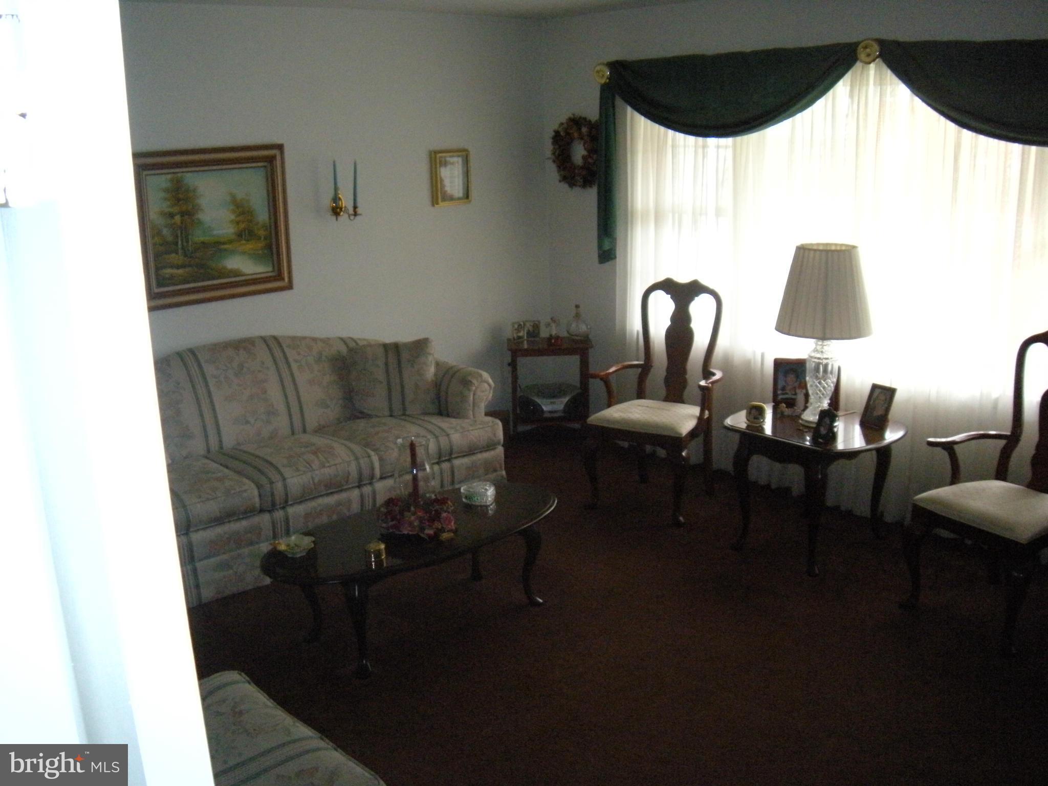 1307 Taney Avenue Frederick, MD 21702 - Photo 5 of 23 a living room with furniture and a wooden floor
