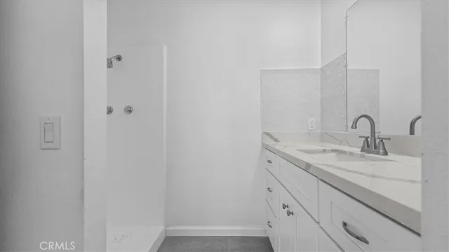 a bathroom with a sink and mirror