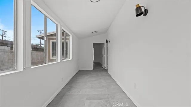 a view of a hallway with windows