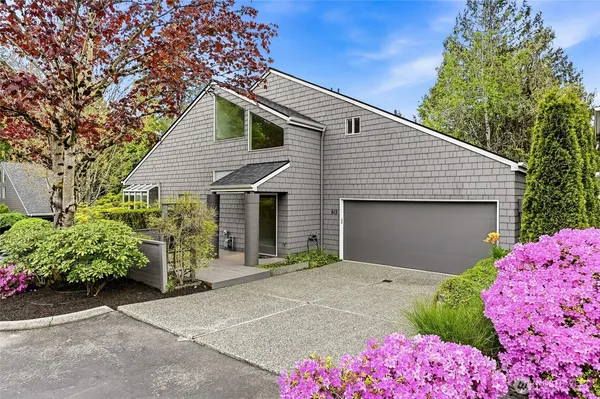a front view of a house with garage