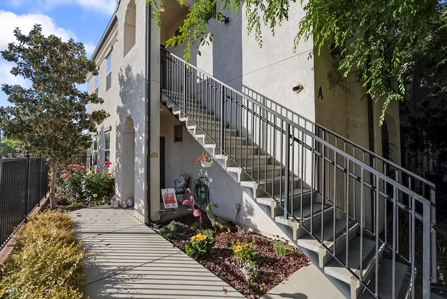 a view of stairs and flowers