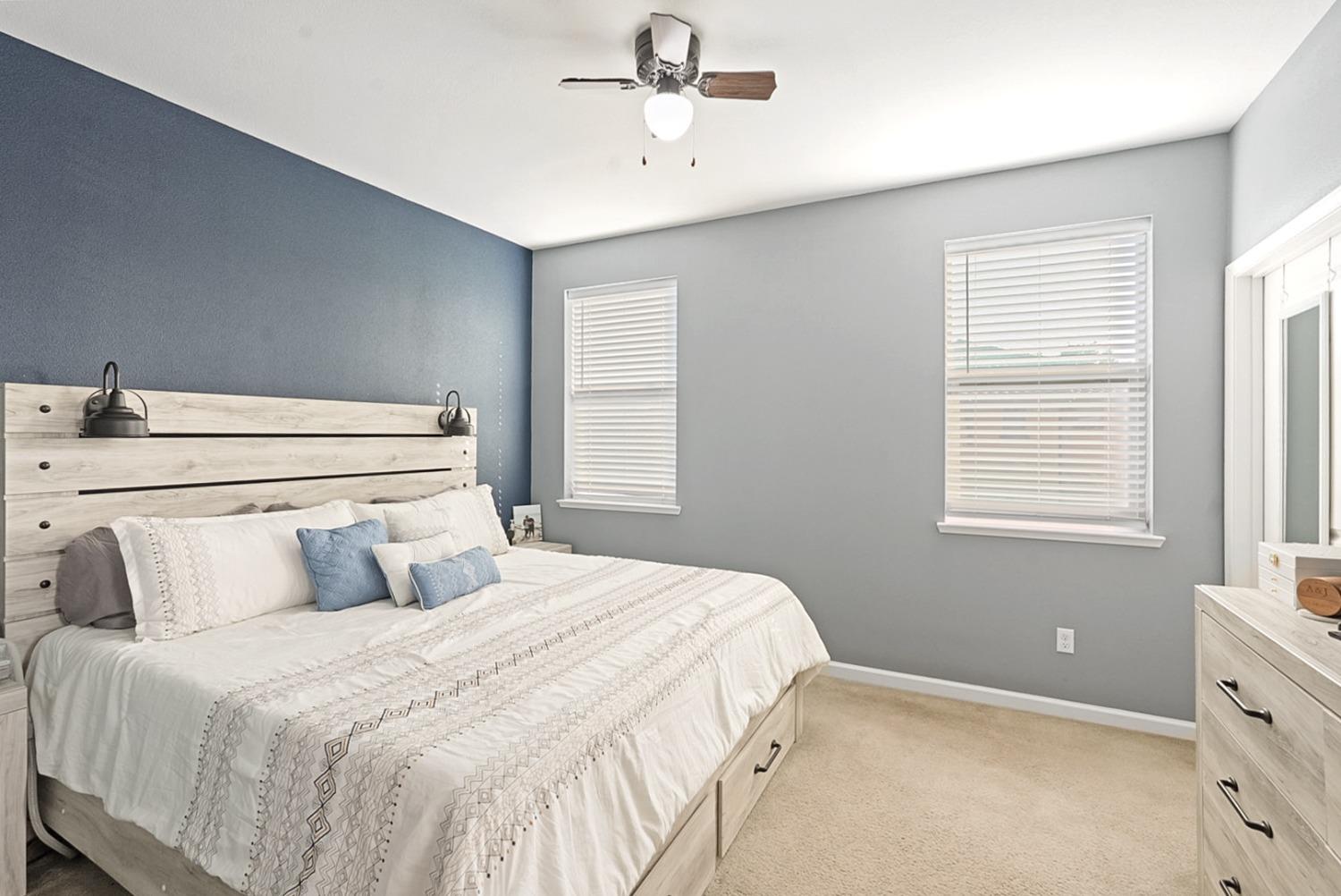 140 Ivy Avenue, Unit A5 Patterson, CA 95363 - Photo 13 of 26 a bedroom with a bed and window