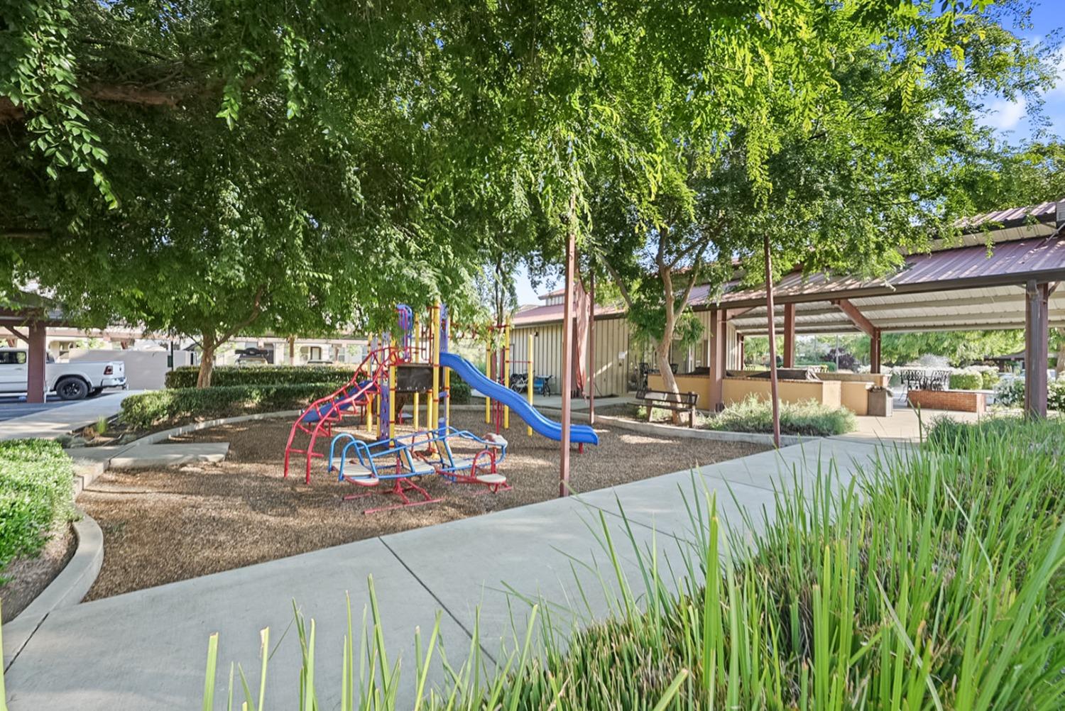 140 Ivy Avenue, Unit A5 Patterson, CA 95363 - Photo 19 of 26 a view of a park with slide