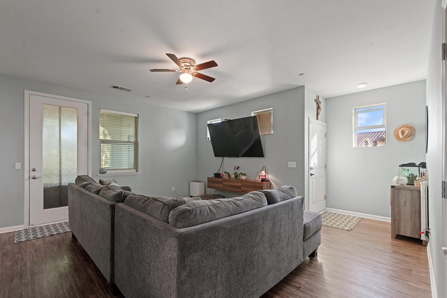 140 Ivy Avenue, Unit A5 Patterson, CA 95363 - Photo 3 of 26 a living room with furniture and a flat screen tv