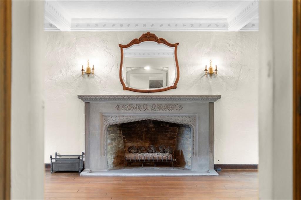 1 Robin Road Pittsburgh, PA 15217 - Photo 11 of 48 a living room with a fireplace and a wooden floor