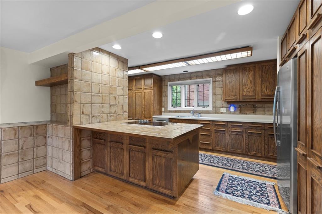 1 Robin Road Pittsburgh, PA 15217 - Photo 16 of 48 a kitchen with stainless steel appliances granite countertop a sink stove and cabinets