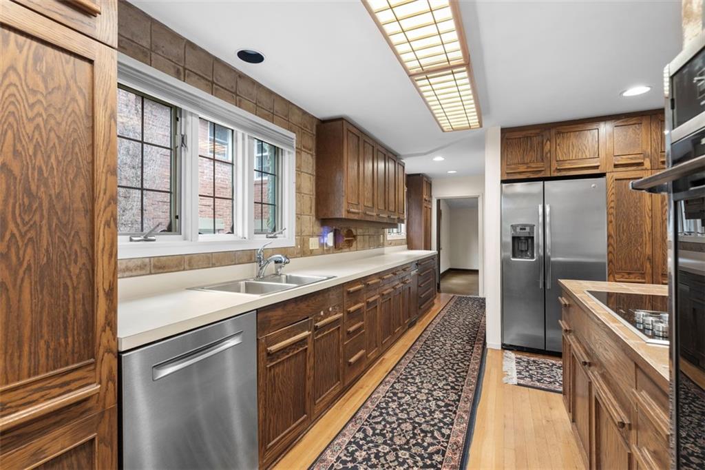 1 Robin Road Pittsburgh, PA 15217 - Photo 18 of 48 a kitchen with stainless steel appliances granite countertop a sink and a refrigerator