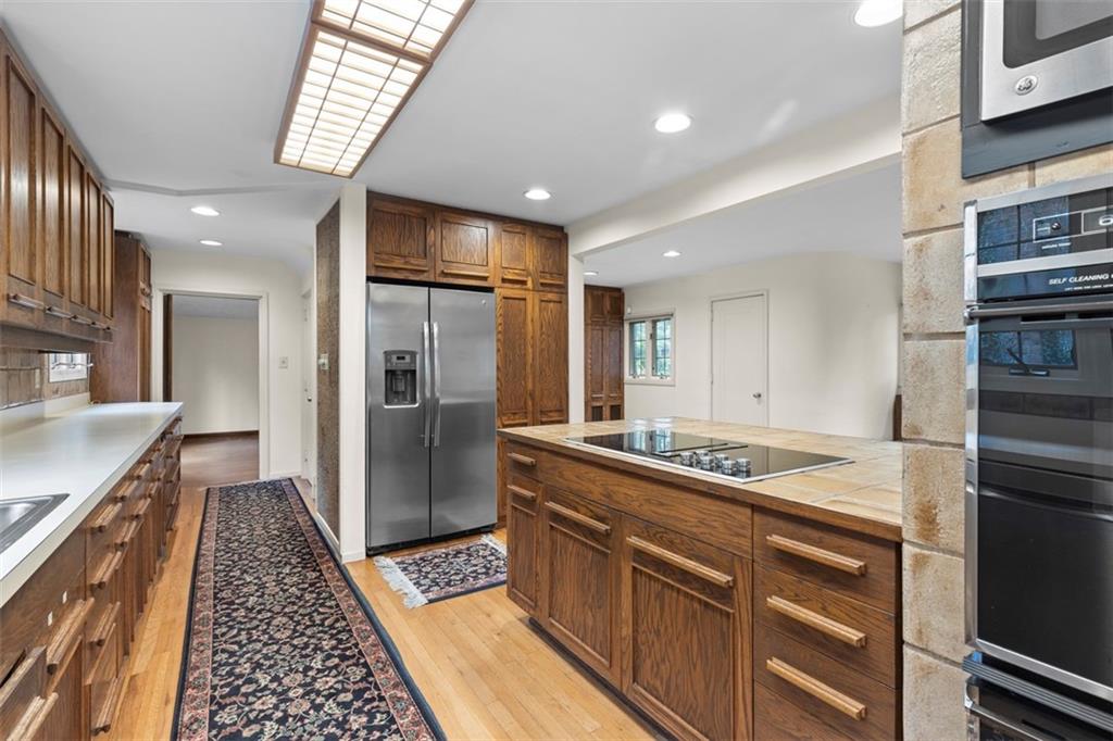 1 Robin Road Pittsburgh, PA 15217 - Photo 19 of 48 a kitchen with stainless steel appliances granite countertop a refrigerator and a sink