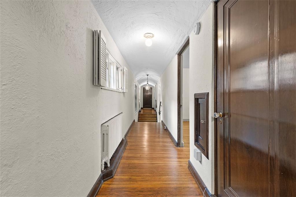 1 Robin Road Pittsburgh, PA 15217 - Photo 24 of 48 a view of a hallway with wooden floor