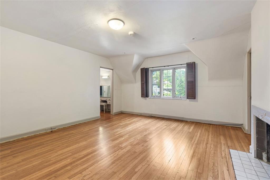 1 Robin Road Pittsburgh, PA 15217 - Photo 31 of 48 an empty room with wooden floor and windows